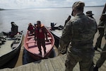 KUCHING, Malaysia (April 7, 2019) – U.S. Army Capt. Perry Foster, assigned to Pacific Partnership 2019, assists Malaysian first responders as they dock their boats during a field training exercise. The event gives local civil response units an opportunity to practice their reaction to a simulated flood disaster with the assistance of partner nation military personnel. Pacific Partnership, now in its 14th iteration, is the largest annual multinational humanitarian assistance and disaster relief preparedness mission conducted in the Indo-Pacific. Each year the mission team works collectively with host and partner nations to enhance regional interoperability and disaster response capabilities, increase security and stability in the region, and foster new and enduring friendships in the Indo-Pacific. (U.S. Navy photo by Mass Communication Specialist 2nd Class William Berksteiner)