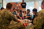 KUCHING, Malaysia (April 6, 2019) – Malaysian secondary school students attend Emergency Preparedness Camp with members of Pacific Partnership 2019. The camp teaches humanitarian assistance and disaster relief awareness by using English as a vehicle for understanding each other. Pacific Partnership, now in its 14th iteration, is the largest annual multinational humanitarian assistance and disaster relief preparedness mission conducted in the Indo-Pacific. Each year the mission team works collectively with host and partner nations to enhance regional interoperability and disaster response capabilities, increase security and stability in the region, and foster new and enduring friendships in the Indo-Pacific. (U.S. Navy photo by Mass Communication Specialist 2nd Class William Berksteiner)