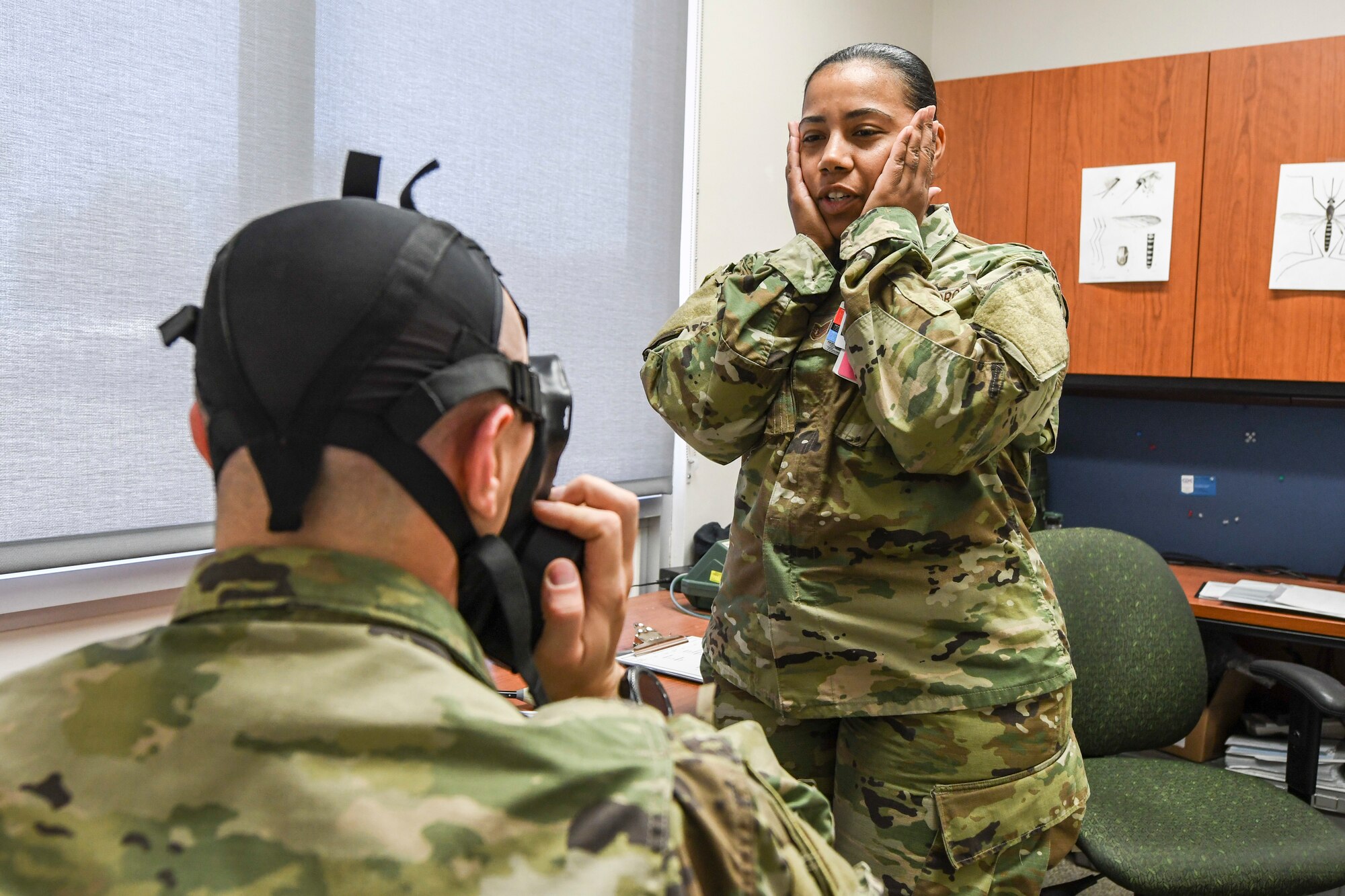 U.S. Air Force TSgt Nakisha Simon, NCO in charge of environment health, administers an M50 gask mask fit test during exercise Bushwhacker 19-05 at Davis-Monthan Air Force Base, Ariz., April 3, 2019.