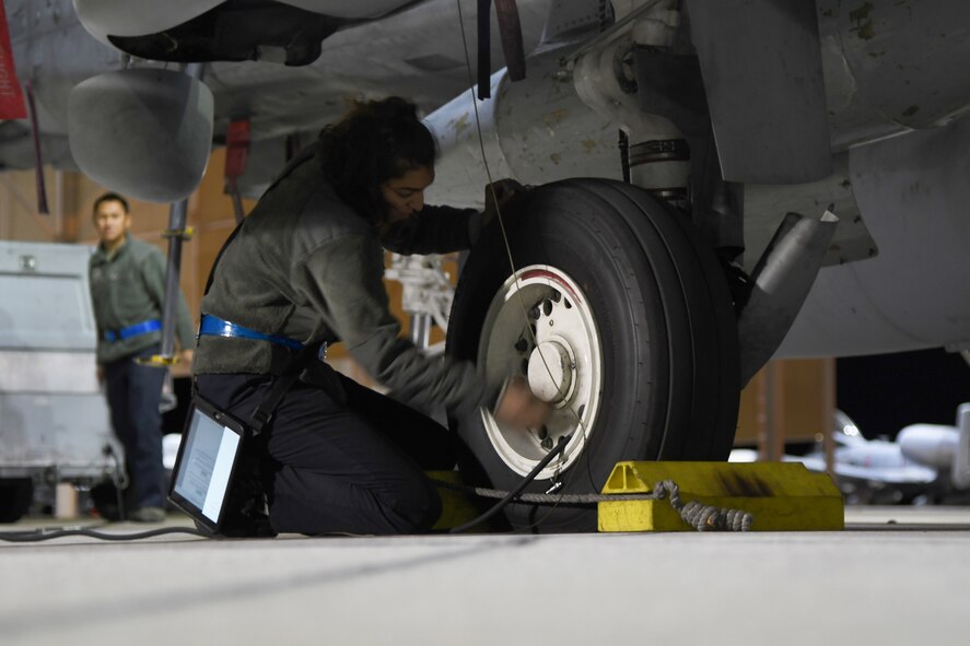 U.S. Air Force Airmen from the 354th Aircraft Maintenance Squadron check the tire pressure on an A-10 Thunderbolt II at Davis-Monthan Air Force Base, Ariz., April 2nd 2019.