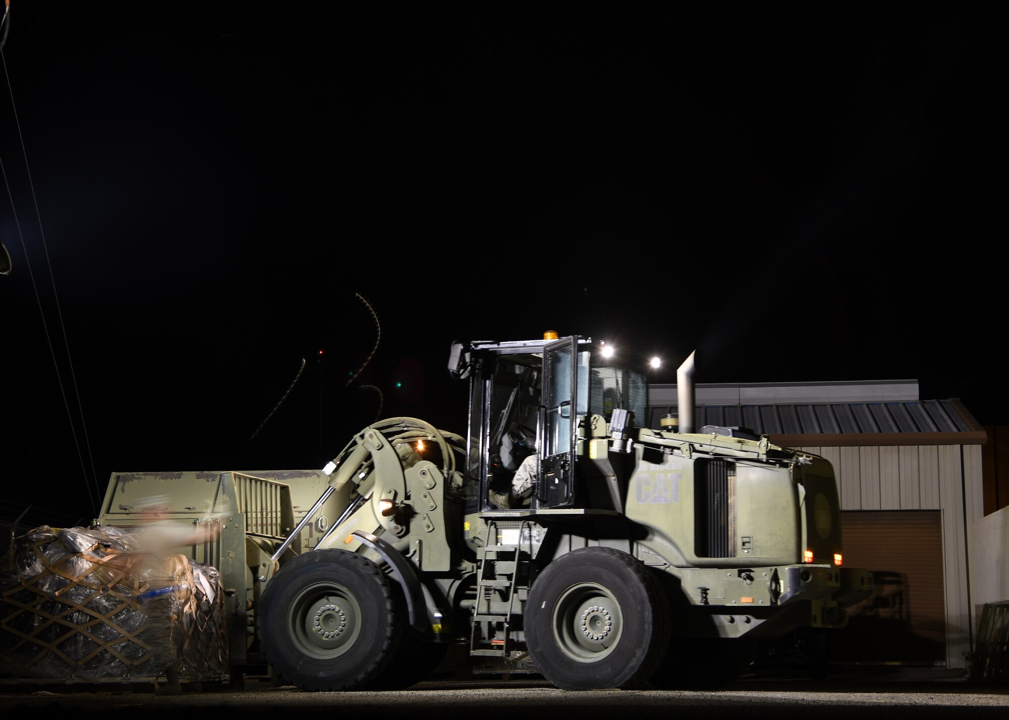 U.S. Air Force Airmen from the 355th Logistics Readiness Squadron load aircraft pallets at Davis-Monthan Air Force Base, Ariz., April 2nd 2019.
