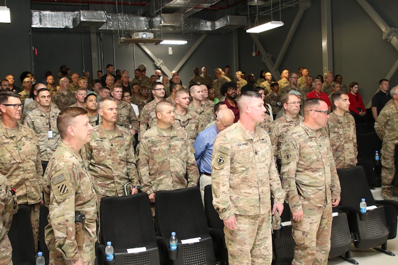 Regimental Engineers from USACE, the 264th, CJENG, JENG and 20th Engineer Brigade stand at attention as the 54th Chief of Engineers enters the town hall meeting held at Bagram, Airfield during a recent visit in theater.