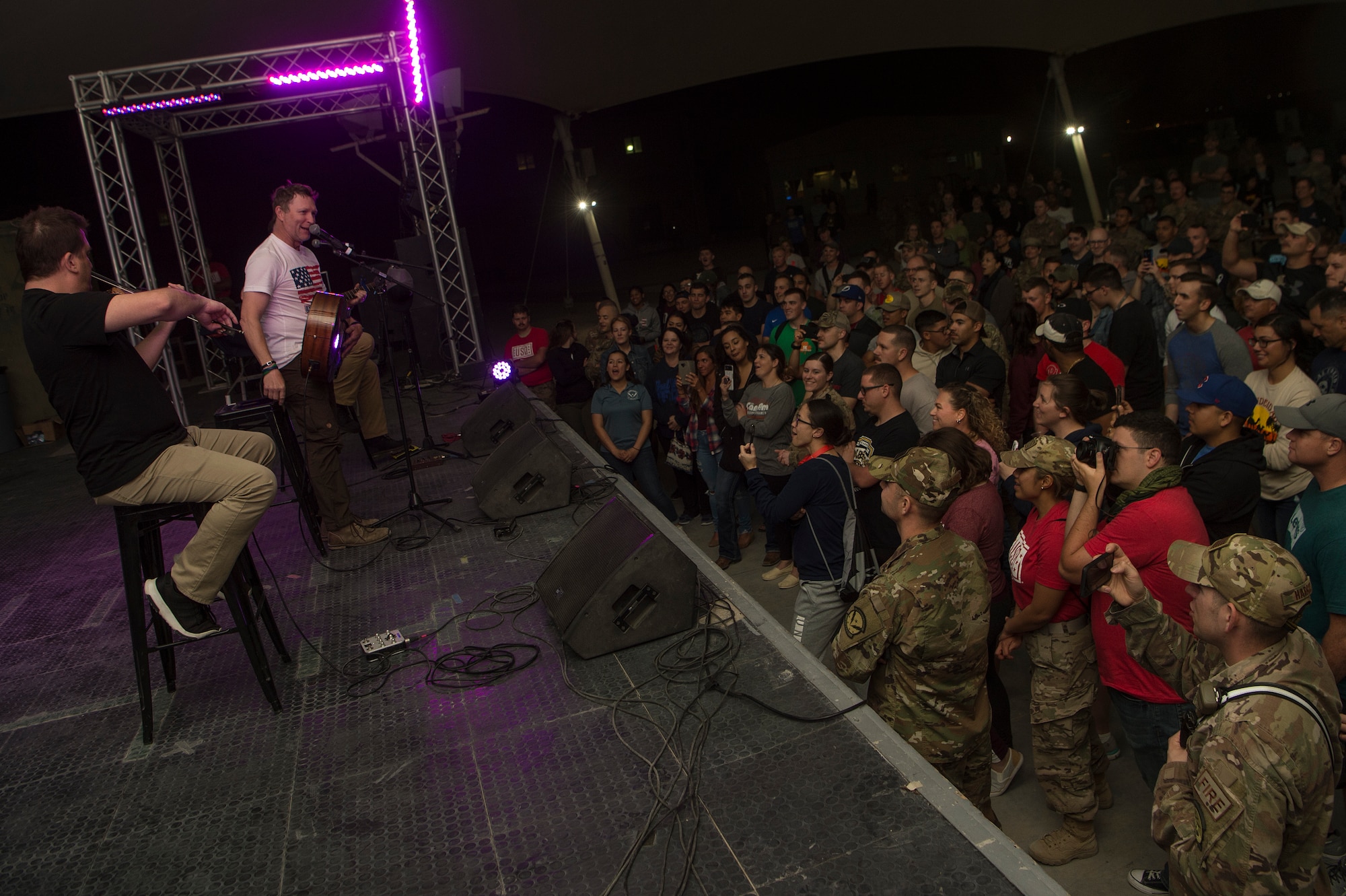 Craig Morgan, country music singer and songwriter, performs for service members during the United Service Organizations (USO) tour April 1, 2019, at Al Udeid Air Base, Qatar. Morgan invited service members to perform alongside him on stage during the show.
