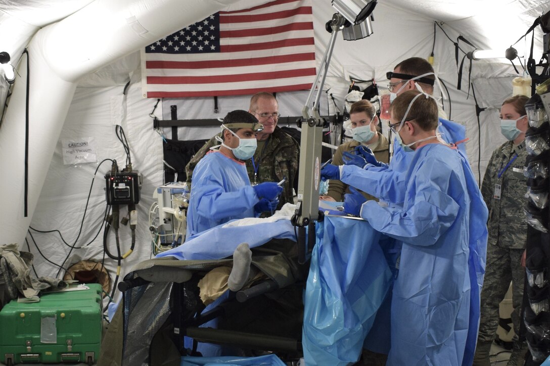Airmen from the 86th Medical Group, Ramstein Air Base, Germany, participate in a multinational medical exercise drill during Vigorous Warrior 19, Cincu Military Base, Romania.
