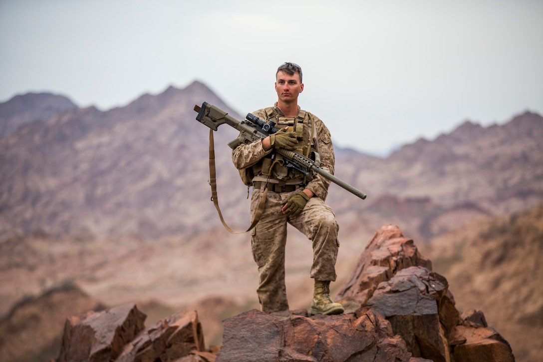 U.S. Marine Cpl. Frederick W. Maul, a designated marksman with 5th Platoon, Charlie Company, Fleet Anti-Terrorism Security Team, Central Command, holds the M110 Semi-Automatic Sniper System during a hike after conducting live-fire range operations. FASTCENT provides expeditionary antiterrorism and security forces to embassies, consulates and other vital national assets throughout the region.