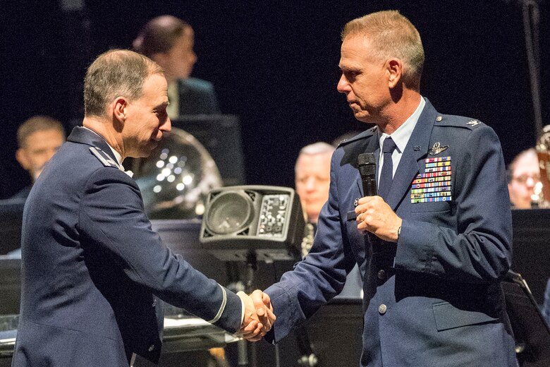 Col. Larry Shaw, 434th Air Refueling Wing Commander, right, thanks Lt. Col. Michael Willen, Air Force Band of Mid-America commander, following their performance April 5, 2019 at McHale Auditorium in Logansport, Indiana. Air Force bands communicate key DOD and Air Forces messages to a wide audience to instill patriotism, build partnerships, enhance the reputation of the Air Force and the United States, as well as demonstrate American values to the world. (U.S. Air Force photo/Douglas Hays)