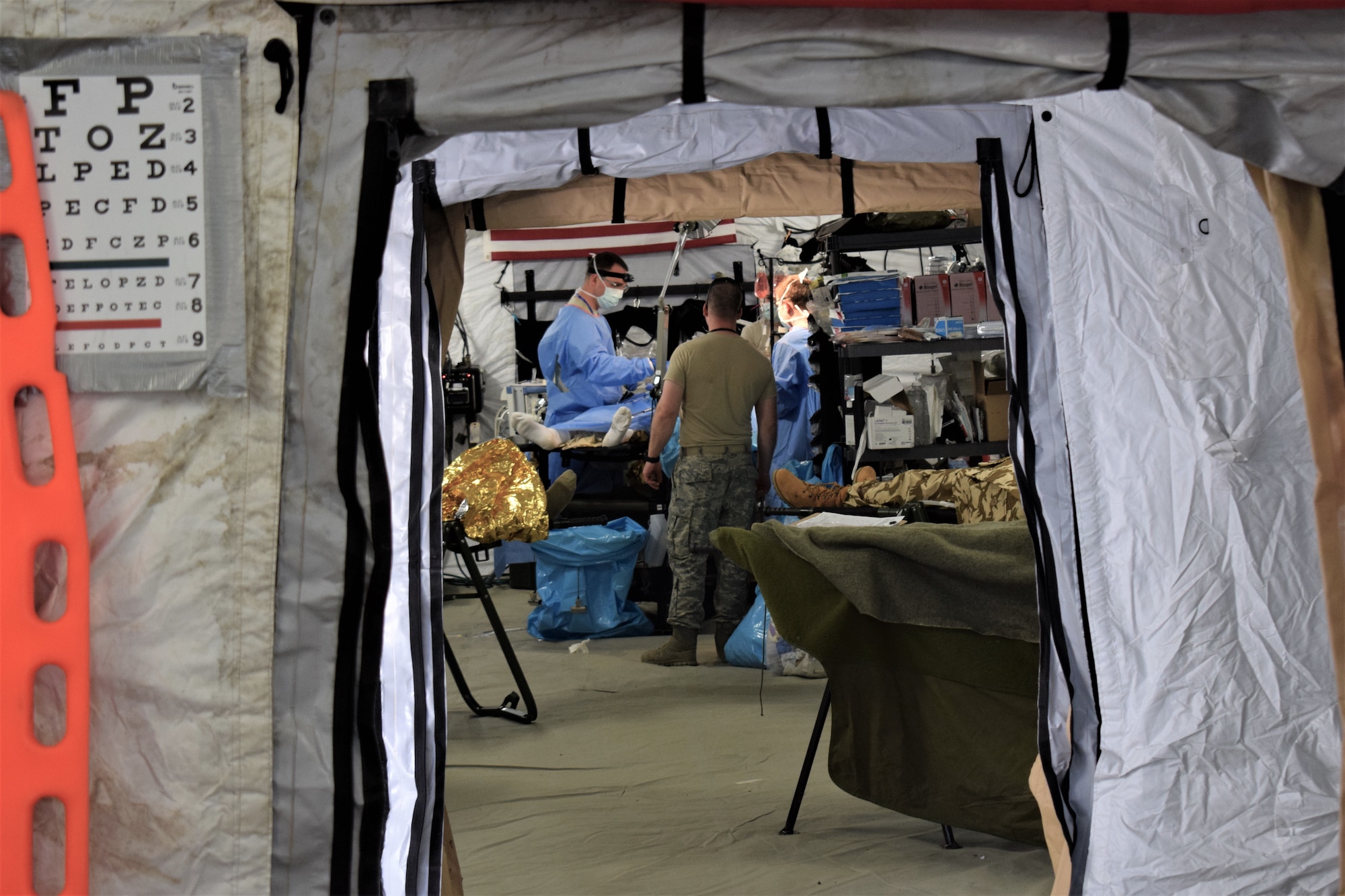 Airmen from the 86th Medical Group, Ramstein Air Base, Germany, participate in a multinational medical exercise drill during Vigorous Warrior 19, Cincu Military Base, Romania.