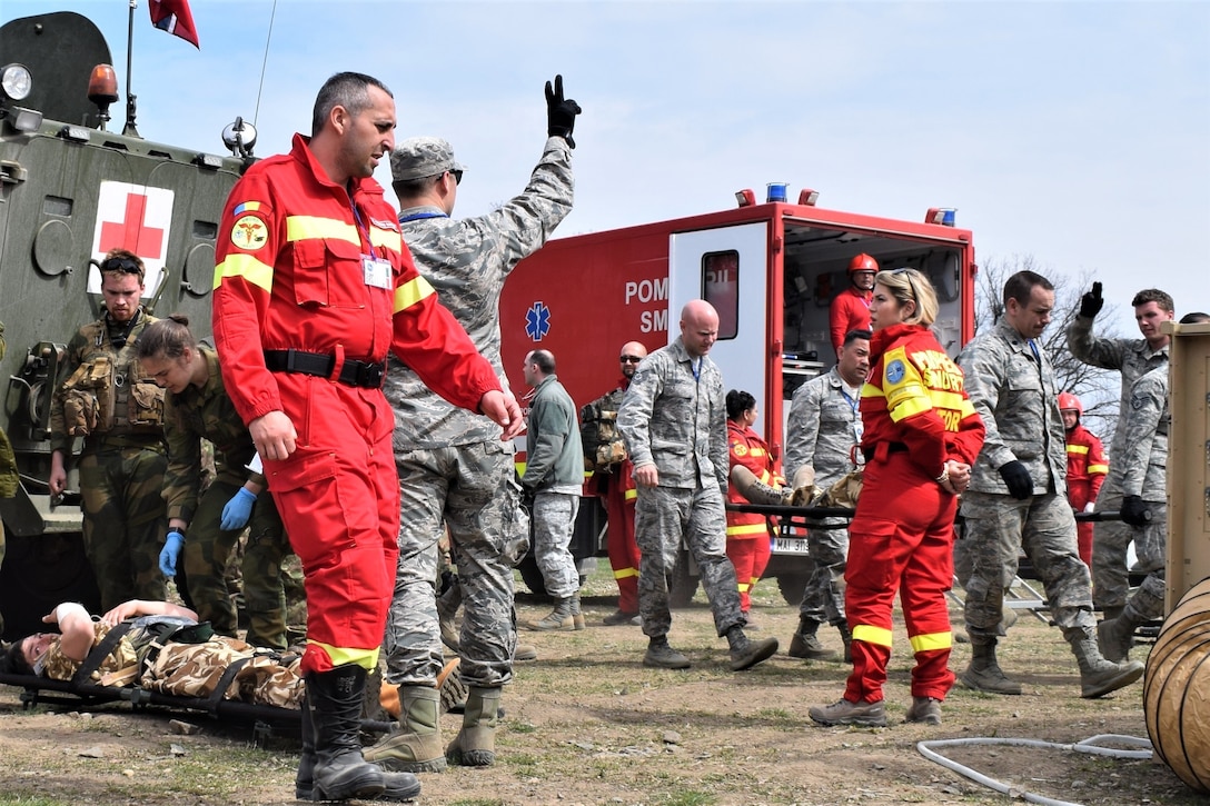 Civilian first responders from Romania participate along with Airmen from the 86th Medical Group, Ramstein Air Base, Germany, in a multinational medical exercise.