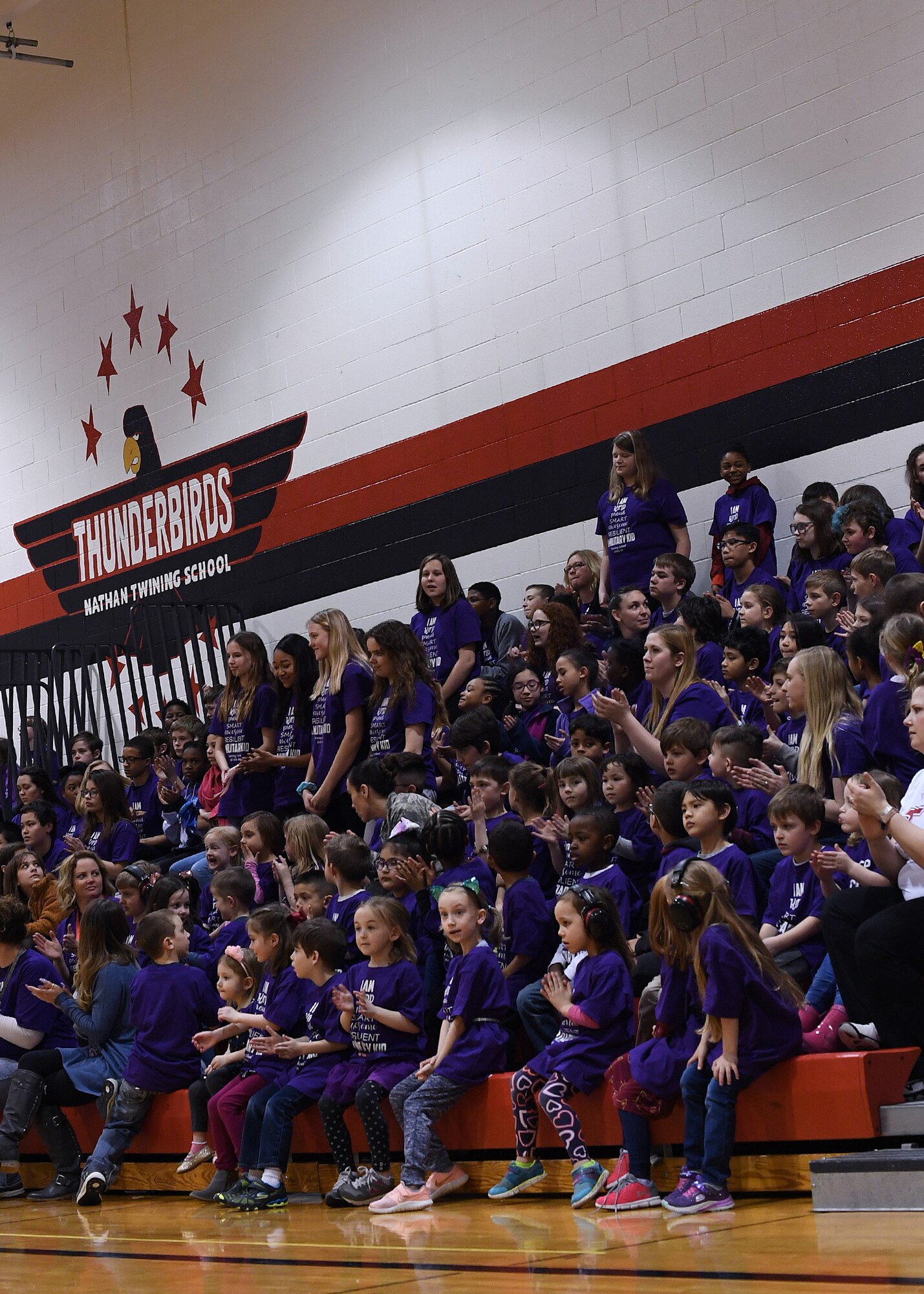 Students and staff applaud during a Month of the Military Child rally April 5, 2019, in Nathan Twining Elementary and Middle School on Grand Forks Air Force Base, North Dakota. The rally began with the school band’s rendition of Queen’s “We Will Rock You,” and ended with an ice cream social. (U.S. Air Force photo by Senior Airman Elora J. Martinez)