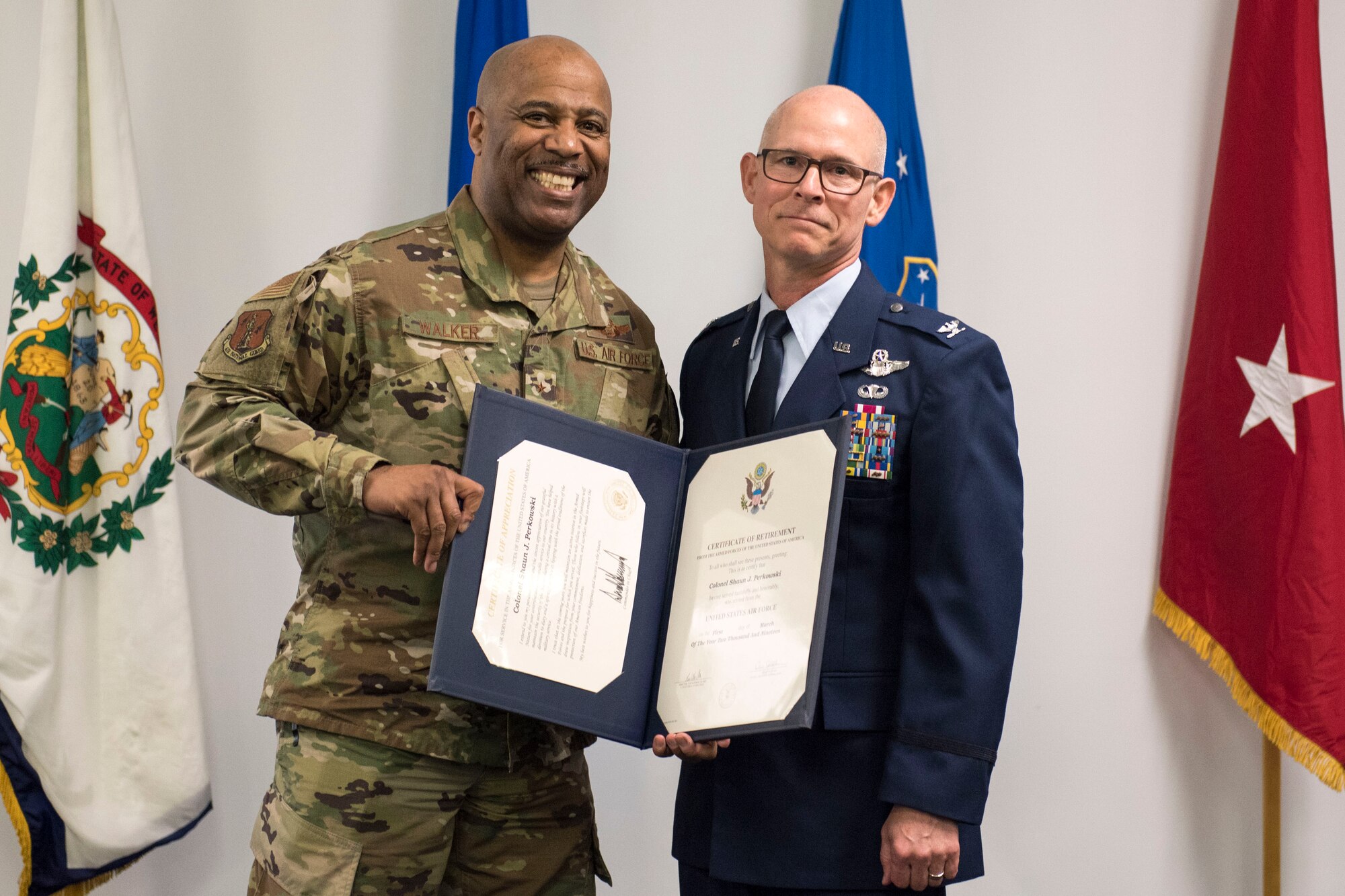 Brig. Gen. Christopher Walker, the West Virginia National Guard’s Assistant Adjutant General- Air, presents Col. Shaun Perkowski with his certificate of retirement during Perkowski’s retirement ceremony. Perkowski was the 167th AW commander from October 2013- October 2018. (U.S. Air National Guard photo by Tech. Sgt. Jodie Witmer)