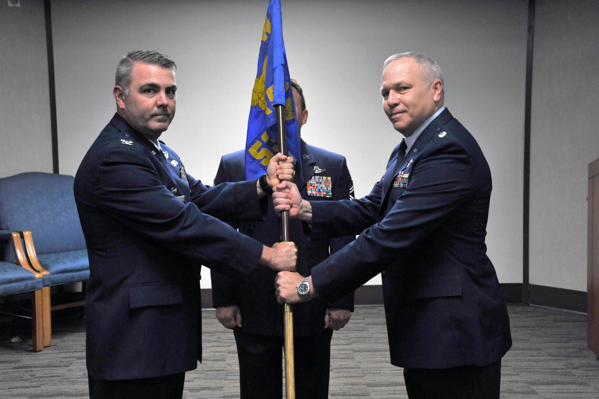 U.S. Air Force Reserve Lt. Col. Dwayne A. Russell (right) accepts command of the 53rd Weather Reconnaissance Squadron from Col. Brian May, 403d Operations Group commander during the 53rd Weather Reconnaissance Squadron change of command ceremony April 6, 2019 at Keesler Air Force Base, Miss. Col. Russell has been with the 53rd WRS since September 1996.  (U.S. Air Force Photo by Tech. Sgt. Sarah Loicano)