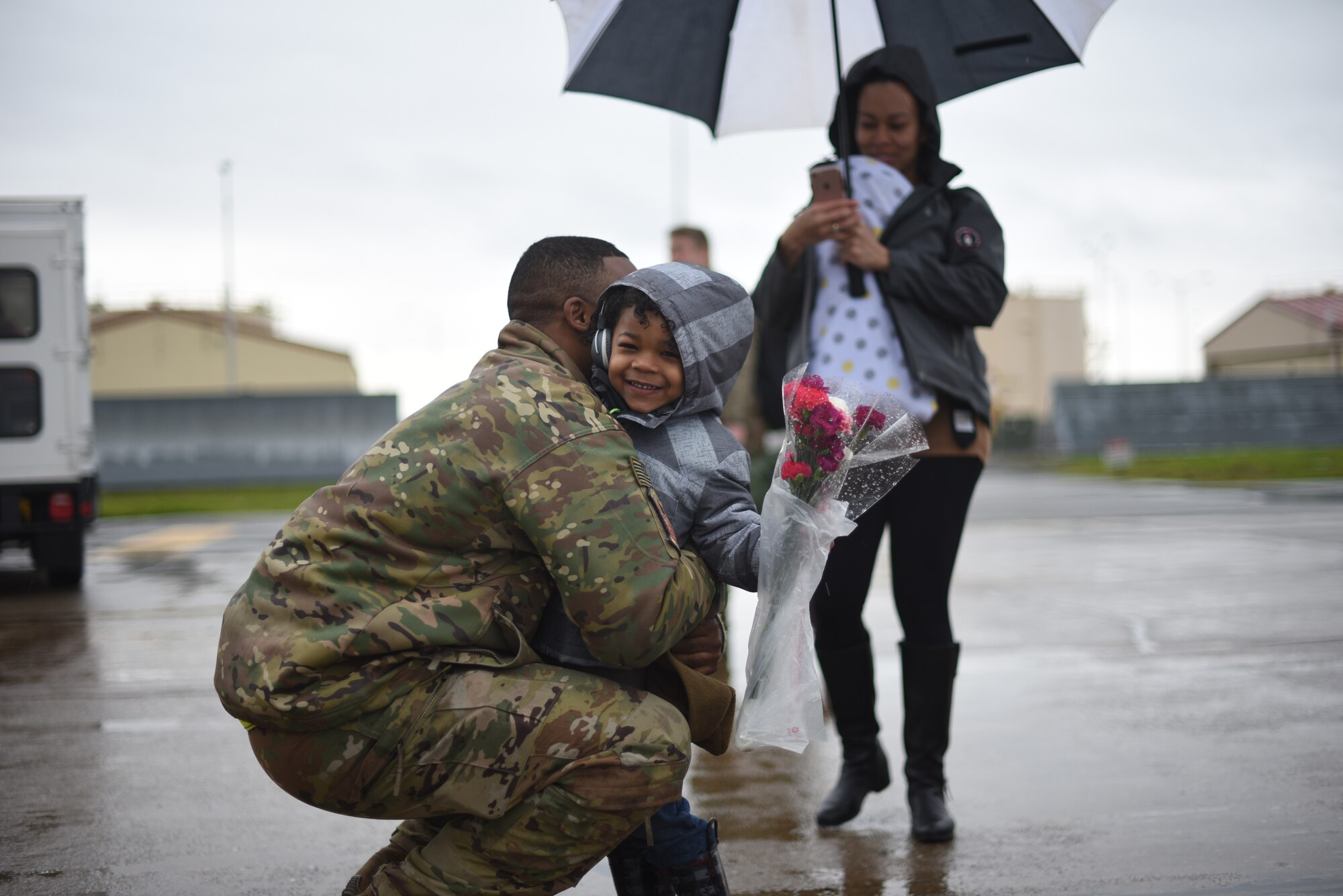 U.S. Air Force Tech. Sgt. Meco Morales, 22nd Airlift Squadron C-5M flight engineer, is greeted upon his return Feb. 25, 2019, by his family after returning to Travis Air Force Base, California, from a two-month deployment. Morales and his team were part of an air bridge that transported U.S. Army cargo and personnel from Rota, Spain, to Afghanistan as part of a joint operation multimodal mission. (U.S. Air Force photos by Staff Sgt. Amber Carter)