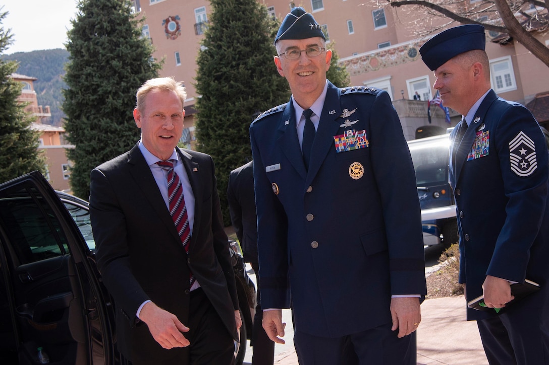 Defense leaders look toward the camera.