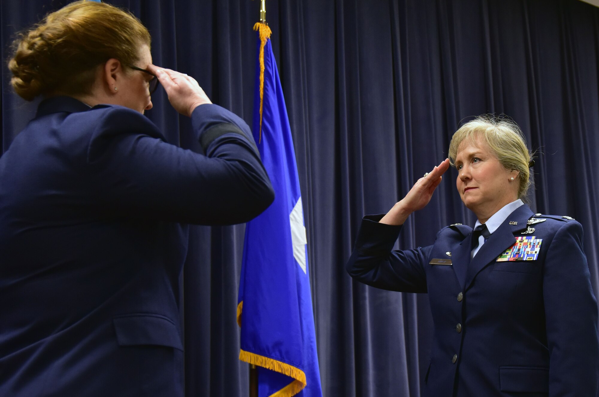 U.S. Air Force Col. Carla Riner, the new wing commander for the 166th Airlift Wing, salutes Assistant Adjutant General for the Delaware Air National Guard Brig. Gen. Wendy Wenke after assuming command April 6, 2019 at the Delaware Air National Guard Base, Del. Riner's previous assignment was with the West Virginia National Guard, and is the first female wing commander for the 166th AW. (U.S. Air Force Photo by Staff Sgt. Nathan Bright)
