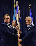 U.S. Air Force Col. Carla Riner, the new wing commander for the 166th Airlift Wing, receives the 166th AW guideon from Assistant Adjutant General for the Delaware Air National Guard Brig. Gen. Wendy Wenke during the assumption of command ceremony April 6, 2019 at the Delaware Air National Guard Base, Del. Riner's previous assignment was with the West Virginia National Guard, and is the first female wing commander for the 166th AW. (U.S. Air Force Photo by Staff Sgt. Nathan Bright)
