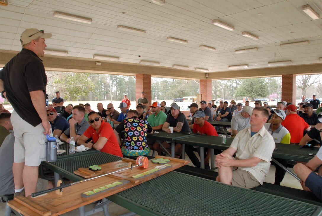 On March 15, 2019 as part of the engineer celebration of St. Patrick, the patron saint for engineers, MCES organized the annual Engineer Golf Tournament at the Paradise Point Golf Course aboard Camp Lejeune, N. C. Marines, civilians, and contractors teamed up in four person teams to build camaraderie and engage in friendly competition. Colonel James H. Bain delivers closing remarks for the golf tournament.