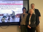 Nina Kessler, a U.S. Agency for International Development Office of U.S. Foreign Disaster Assistance humanitarian assistance advisor, left, Dorothy O’Connell, a DLA Troop Support J3/5 Plans and Operations customer support liaison, center, and Elizabeth Smithwick, a USAID OFDA humanitarian assistance advisor, right, pose for a photo at DLA Troop Support April 3, 2019 in Philadelphia.