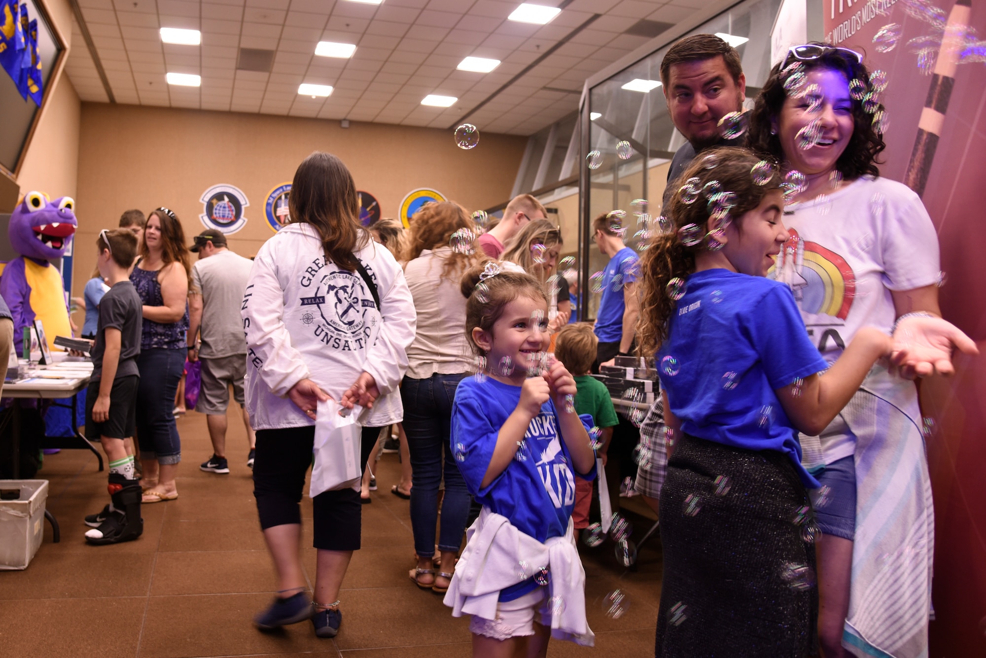 Airmen and their families view several mission partner’s expos at the 5th Space Launch Squadron during the 45th Space Wing Family Day self guided tour of Cape Canaveral Air Force Station, Fla. on April 6, 2019.