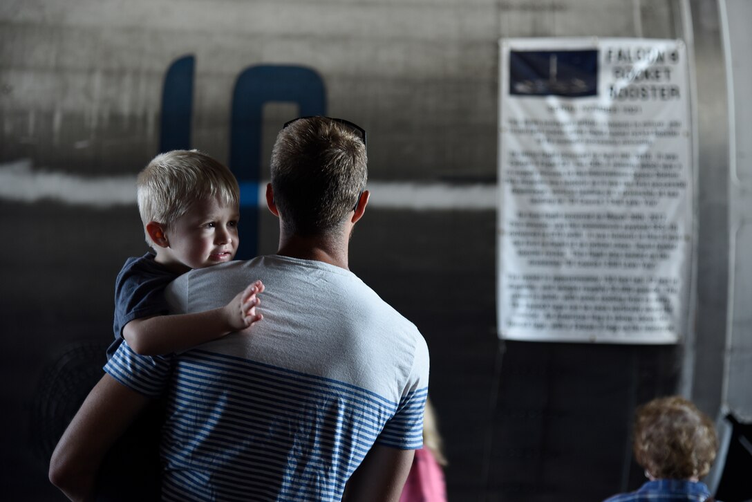 Hunt Fowler and his son Nate view a twice recovered Falcon-9 booster during the 45th Space Wing Family Day self guided tour of Cape Canaveral Air Force Station, Fla. on April 6, 2019.