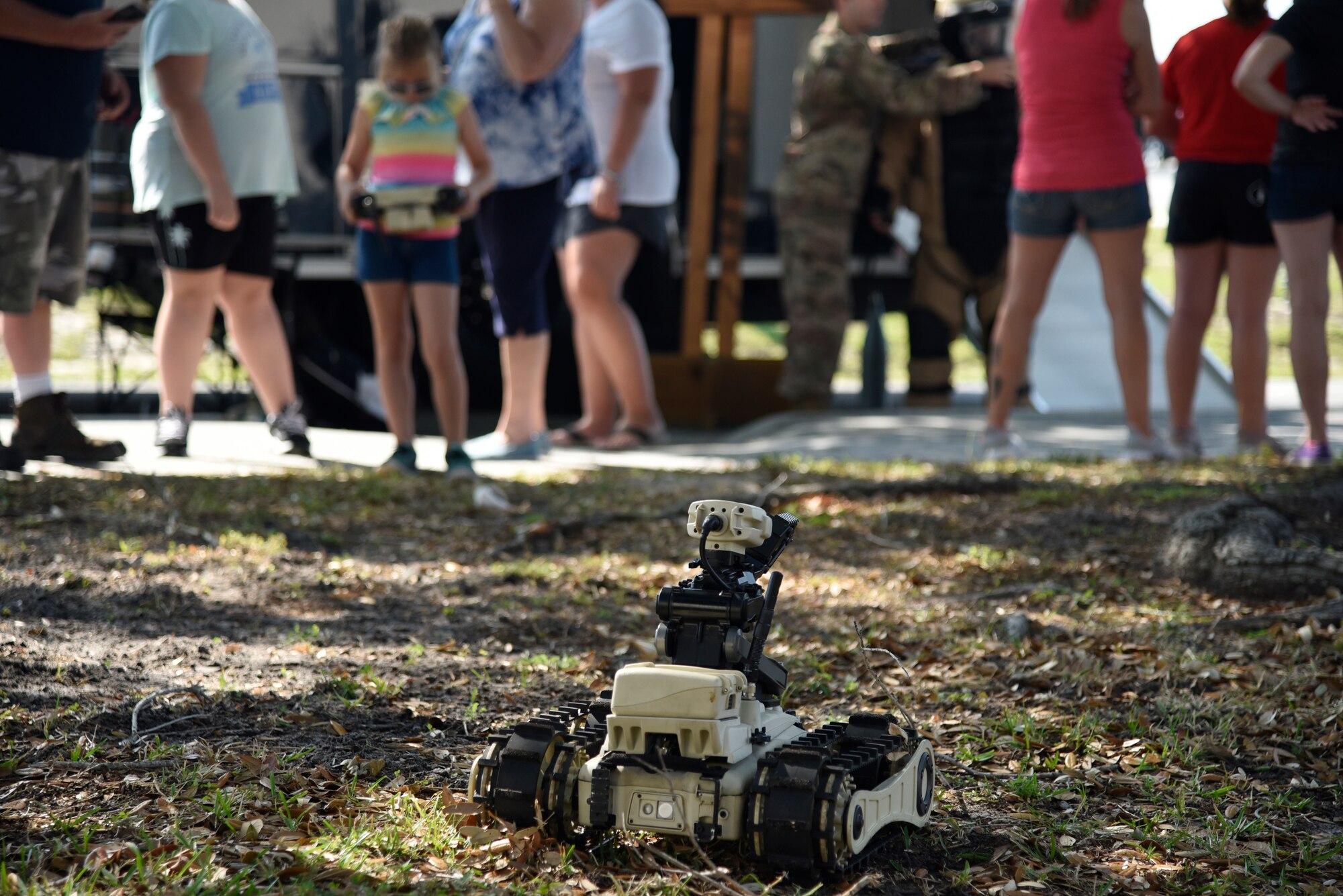 Families handle the 45th Civil Engineering Squadron Explosive Ordnance Disposal team’s equipment during the 45th Space Wing Family Day self guided tour of Cape Canaveral Air Force Station, Fla. on April 6, 2019.