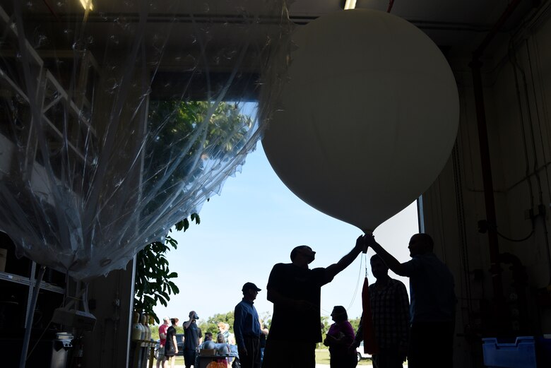 45th Weather Squadron Airmen give families a weather balloon demonstration during the 45th Space Wing Family Day self guided tour of Cape Canaveral Air Force Station, Fla. on April 6, 2019.