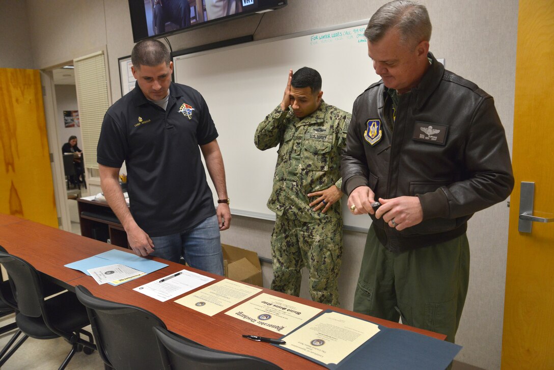 Seaman reenlists aboard a Super Galaxy