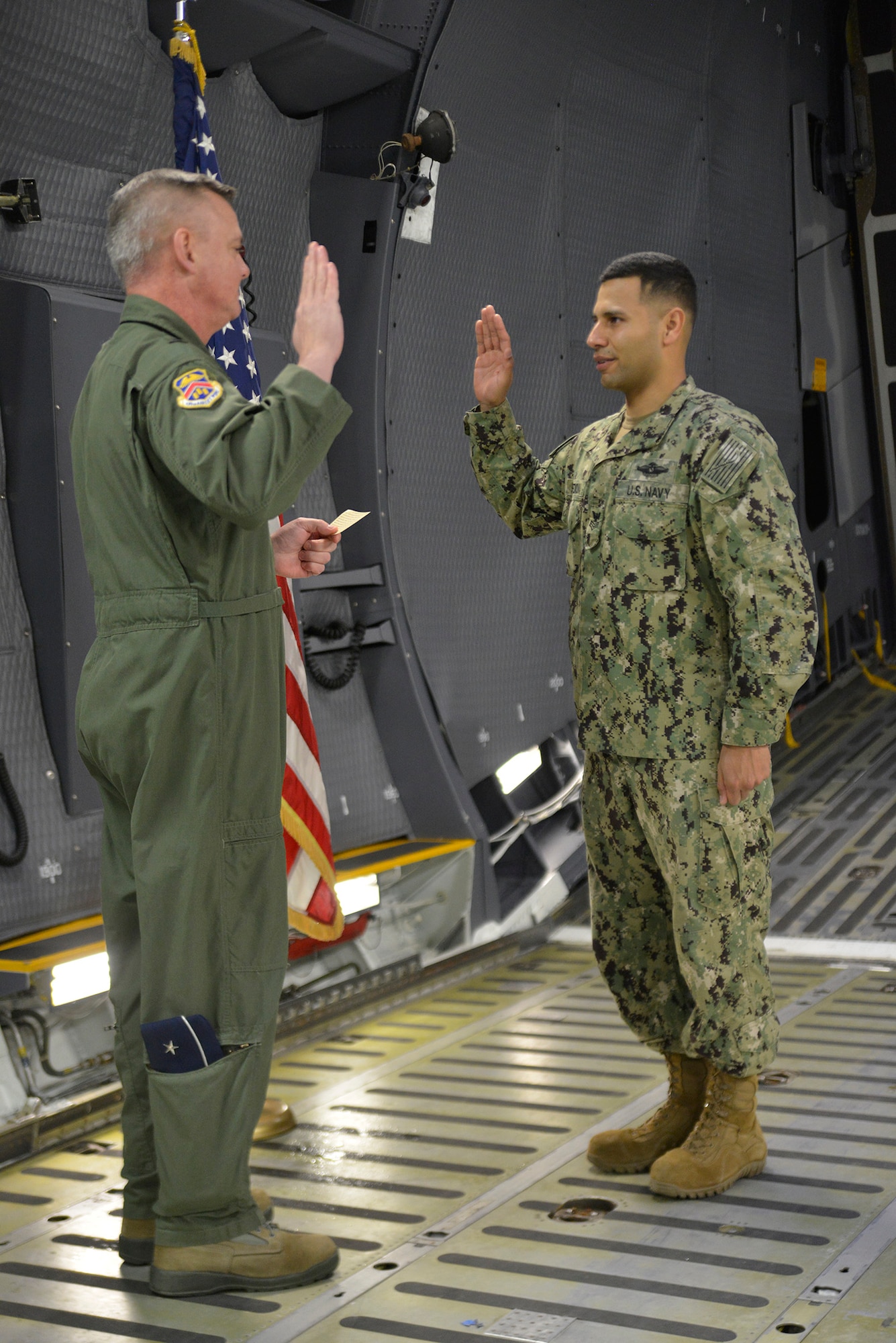 Seaman reenlists aboard a Super Galaxy