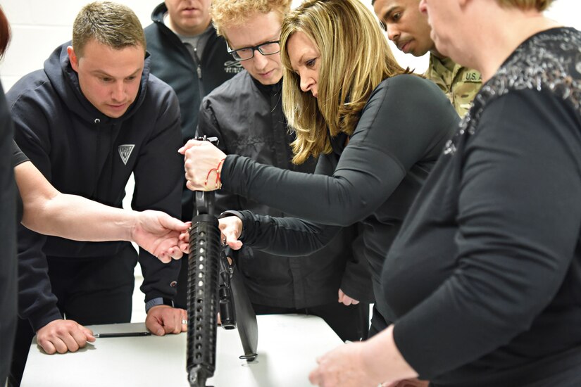 Honorary Commander Regina Arcuri is shown how to assemble a rifle at Joint Base McGuire-Dix-Lakehurst, New Jersey, April 5, 2019.  The Honorary Commander program provides a unique experience to key community leaders, giving them hands on military training.  (U.S. Air Force photo by 1st Lt. Jaclyn Sumayao)