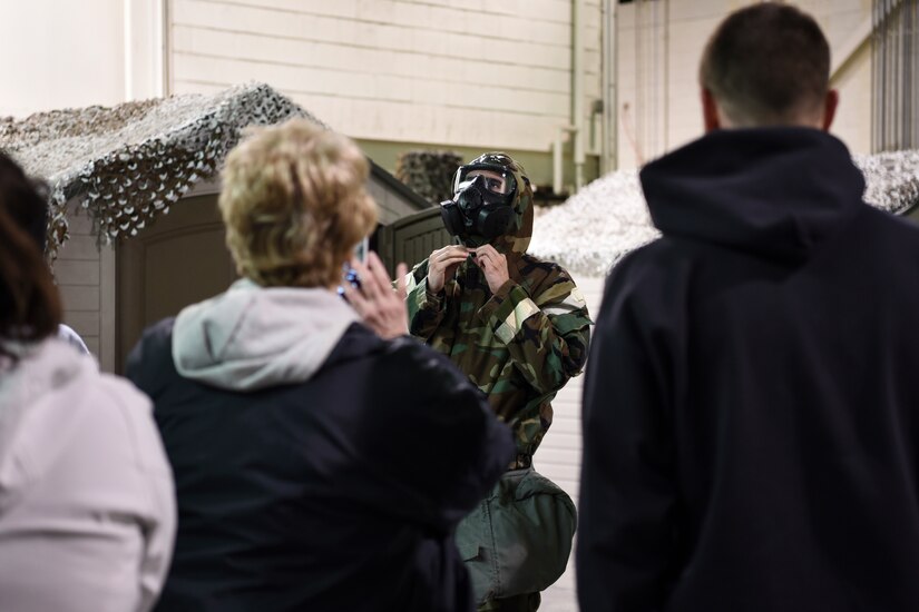An Honorary Commander dons protective gear at Joint Base McGuire-Dix-Lakehurst, New Jersey, April 5, 2019.  Honorary Commanders are given a crash course on wearing protective gear to understand the purpose of the equipment and catch a glimpse of military life.  (U.S. Air Force photo by 1st Lt. Jaclyn Sumayao)