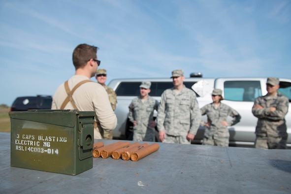 U.S. Air Force Staff Sgt. Evan Weier, an explosive ordnance disposal technician with the 45th Civil Engineer Squadron's EOD flight, gives a safety briefing to members of the Air Force Technical Applications Center prior to detonating explosives at Cape Canaveral Air Force Station, Florida, March 13, 2019.  Weier and his EOD co-workers assisted members of AFTAC's Systems Development Directorate with testing a prototype geodesic dome to help the nuclear treaty monitoring center capture hydroacoustic data. (U.S. Air Force photo by Matthew S. Jurgens)