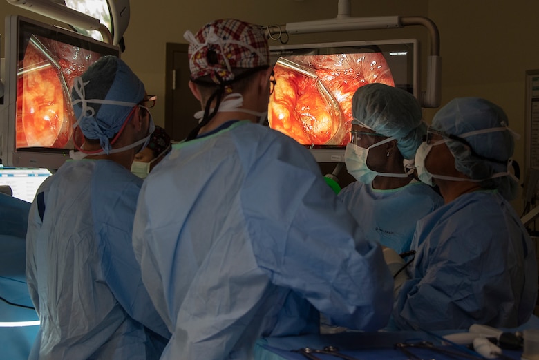 Medical staff at David Grant USAF Medical Center view monitors while performing video-assisted thoracoscopic surgery to remove the upper left lobe of a cancer patient's lung Feb. 26, 2019 at Travis Air Base, California. During the procedure, surgeons inserted a tiny camera (thoracoscope) into the patient’s chest through two small incisions. The thoracoscope transmits images to monitors, guiding the surgeons in performing the procedure. (U.S. Air Force photo by Heide Couch)