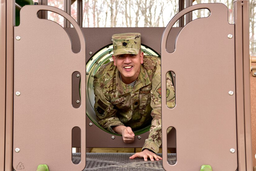 Lt. Col. Jason Guadalupe, 11th Force Support Squadron commander, test runs the new Child Development Center 2 playground on Joint Base Andrews, Md., April 4, 2019. The playground is available for children from the ages of three to five years old. (U.S. Air Force photo by Airman 1st Class Noah Sudolcan)