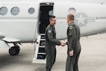 U.S. Air Force Lt. Gen. Kevin Schneider, U.S. Forces Japan and Fifth Air Force commander, shakes hands with Brig. Gen. Case A. Cunningham, 18th Wing commander, upon arrival April 4, 2019, to Kadena Air Base, Japan. Schneider assessed the mission readiness of the 18th Wing and III Marine Expeditionary Force on Okinawa. (U.S. Air Force photo by Staff Sgt. Omari Bernard)