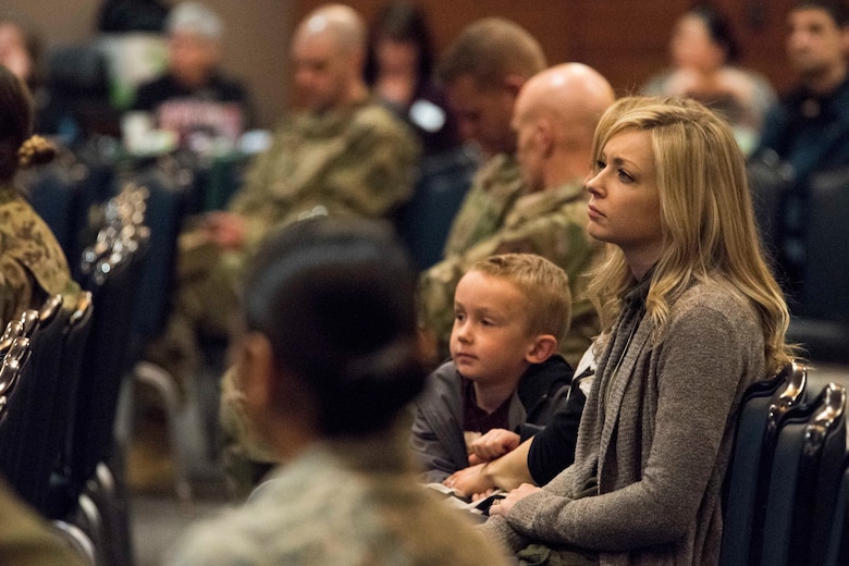 Nikki Shuler, wife of U.S. Air Force Capt. Alex Shuler, a 90th Fighter Squadron F-22 Raptor pilot, listens to resource providers during a welcome reception at Joint Base Elmendorf-Richardson, Alaska, April 8, 2019. The JBER Support to Tyndall Airmen and Families Reception was a one-stop information fair connecting them with the appropriate agencies to address their immediate and specific needs and to learn more about services they offer.