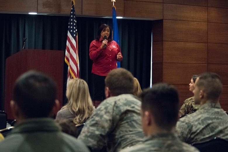 Paola Pacheco, a Military One Source state consultant, speaks during a welcome reception at Joint Base Elmendorf-Richardson, Alaska, April 8, 2019. The JBER Support to Tyndall Airmen and Families Reception was a one-stop information fair connecting them with the appropriate agencies to address their immediate and specific needs and to learn more about services they offer.