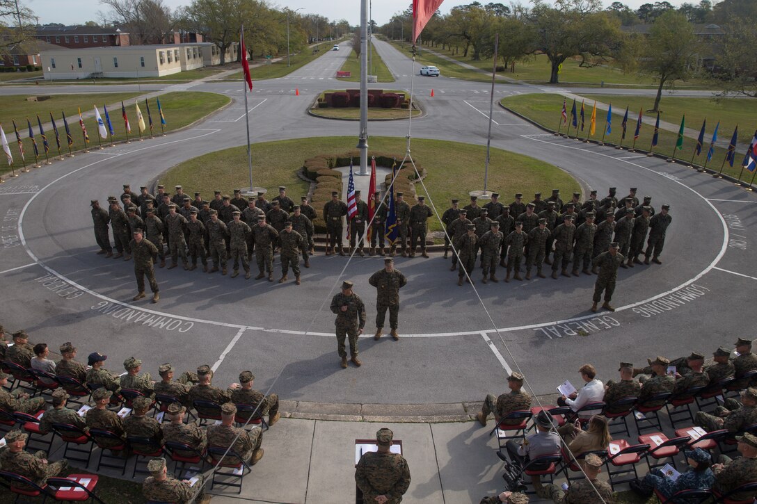 U.S. Sailors with 2nd Marine Logistics Group muster during a change of charge ceremony at Camp Lejeune, N.C., April 4, 2019.  Master Chief Petty Officer Christopher Rebana was relieved by Master Chief Petty Officer Richard A. Jackson as command master chief of 2nd MLG. (U.S. Marine Corps photo by Lance Cpl. Scott Jenkins)