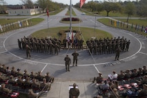 U.S. Sailors with 2nd Marine Logistics Group stand in formation during a change of charge ceremony at Camp Lejeune, N.C., April 4, 2019.  Master Chief Petty Officer Christopher Rebana was relieved by Master Chief Petty Officer Richard A. Jackson as command master chief of 2nd MLG. (U.S. Marine Corps photo by Lance Cpl. Scott Jenkins)