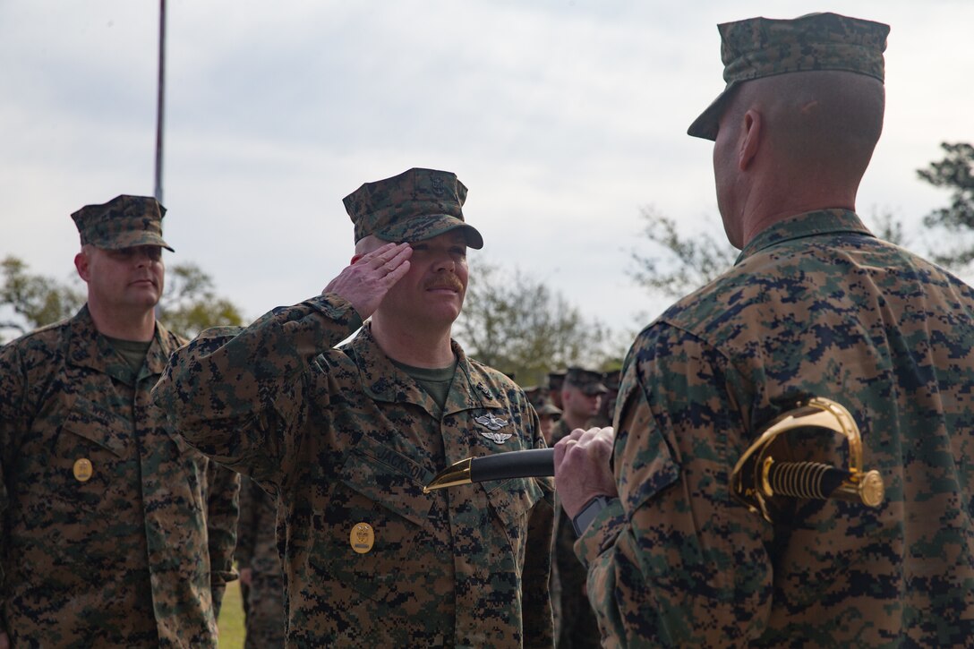U.S. Navy Master Chief Petty Officer Richard A. Jackson, on-coming command master chief of 2nd Marine Logistics Group, salutes Brig. Gen. Kevin Stewart, commanding general of 2nd MLG during a change of charge ceremony at Camp Lejeune, N.C., April 4, 2019. Master Chief Petty Officer Christopher Rebana was relieved by Master Chief Petty Officer Richard A. Jackson as command master chief of 2nd MLG. (U.S. Marine Corps photo by Lance Cpl. Scott Jenkins)