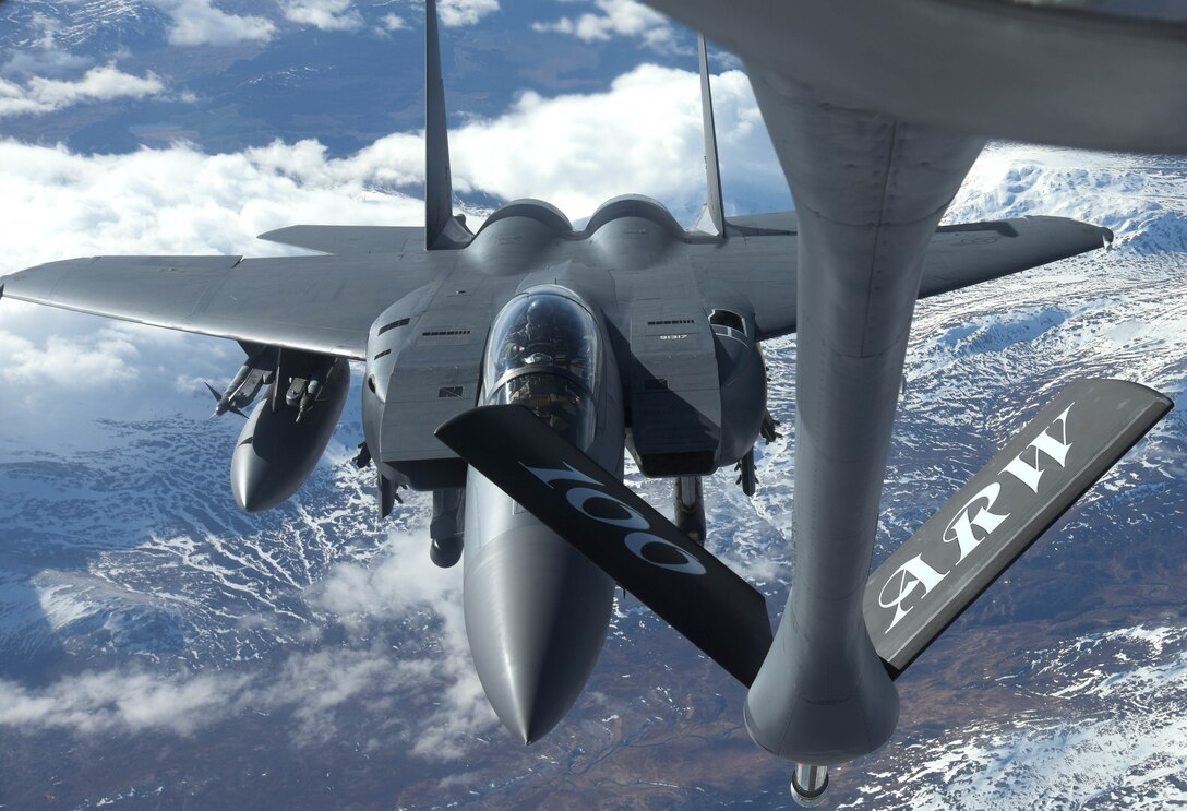 A U.S. Air Force F-15E Strike Eagle assigned to 494th Fighter Squadron, RAF Lakenheath, prepares to receive fuel from a U.S. Air Force KC-135 Stratotanker from the 100th Air Refueling Wing over Scotland, March 29, 2018. The Strike Eagle was one of eight F-15Es to receive fuel while on a training sortie. (U.S. Air Force photo by Airman 1st Class Benjamin Cooper)