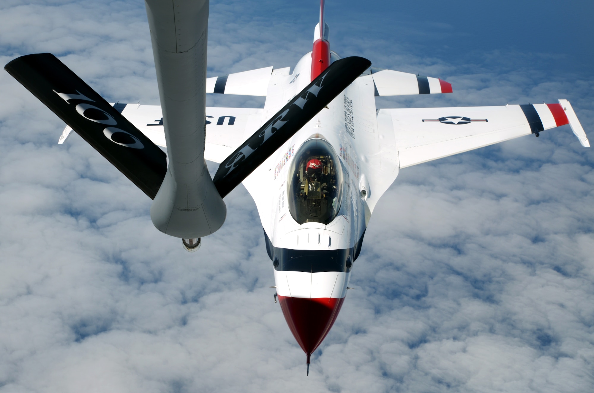 A U.S. Air Force F-16 Thunderbird pilot prepares to refuel from a KC-135 Stratotanker assigned to the 100th Air Refueling Wing July 10, 2017, over the Isle of Skye, Scotland. The Thunderbirds rehearsed their routines in preparation for the 2017 Royal International Air Tattoo airshow. (U.S. Air Force photo by Airman 1st Class Benjamin Cooper)