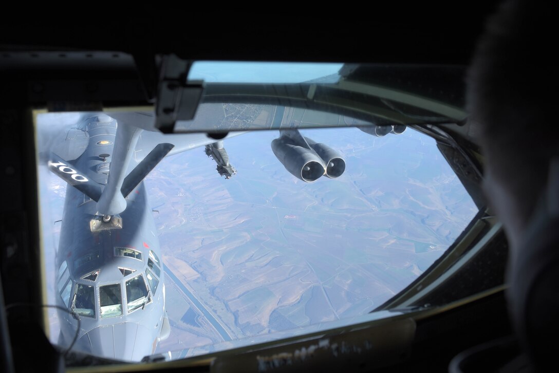 U.S. Air Force Senior Airman Derek Peifer, 351st Air Refueling Squadron boom operator, makes contact with the B-52 Stratofortress, 2nd Bomb Wing Barksdale, La., over Romania, March 18, 2019. During air refueling, the boom operator communicates directly with the refueling aircraft to ensure safety and efficiency. The KC-135 mission supported the B-52 deployed to Europe as part of the Bomber Task Force rotation.  (U.S. Air Force photo by Senior Airman Benjamin Cooper)