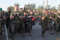 U.S. Marines with 8th Engineer Support Battalion, 2nd Marine Logistics Group, pull a chariot that they built while competing in the Marine Corps Engineer School Saint Patrick’s Day Field Meet on Camp Lejeune, North Carolina, March 14, 2019. Marines competed in the field meet to strengthen community and camaraderie in the spirit of friendly competition