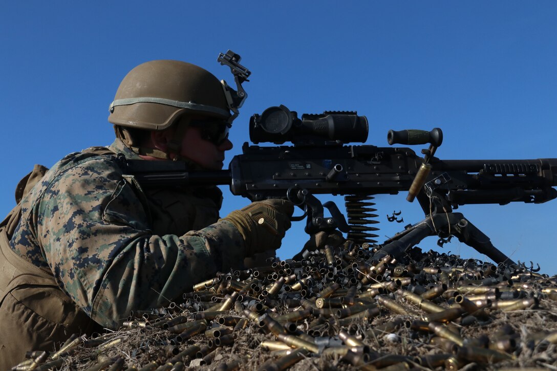 A U.S. Marine with Special Purpose Marine Air-Ground Task Force-Crisis Response-Africa 19.1, Marine Forces Europe and Africa, fires a M240B machine gun during Platinum Eagle 19.1, a multilateral training exercise held at Babadag Training Area, Romania, March 18, 2019