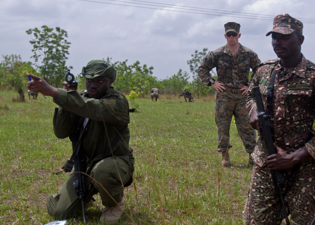 Members of the Ghanaian ministry of the interior conduct a patrolling exercise while a U.S. Marine with Special Purpose Marine Air-Ground Task Force-Crisis Response-Africa 19.1, Marine Forces Europe and Africa, supervises during a theater-security cooperation event in Asutsuare, Ghana, March 19, 2019. SPMAGTF-CR-AF is deployed to conduct crisis-response and theater-security operations in Africa and promote regional stability by conducting military-to-military training exercises throughout Europe and Africa. (U.S. Marine Corps photo by 1st Lt. Taylor Cox)