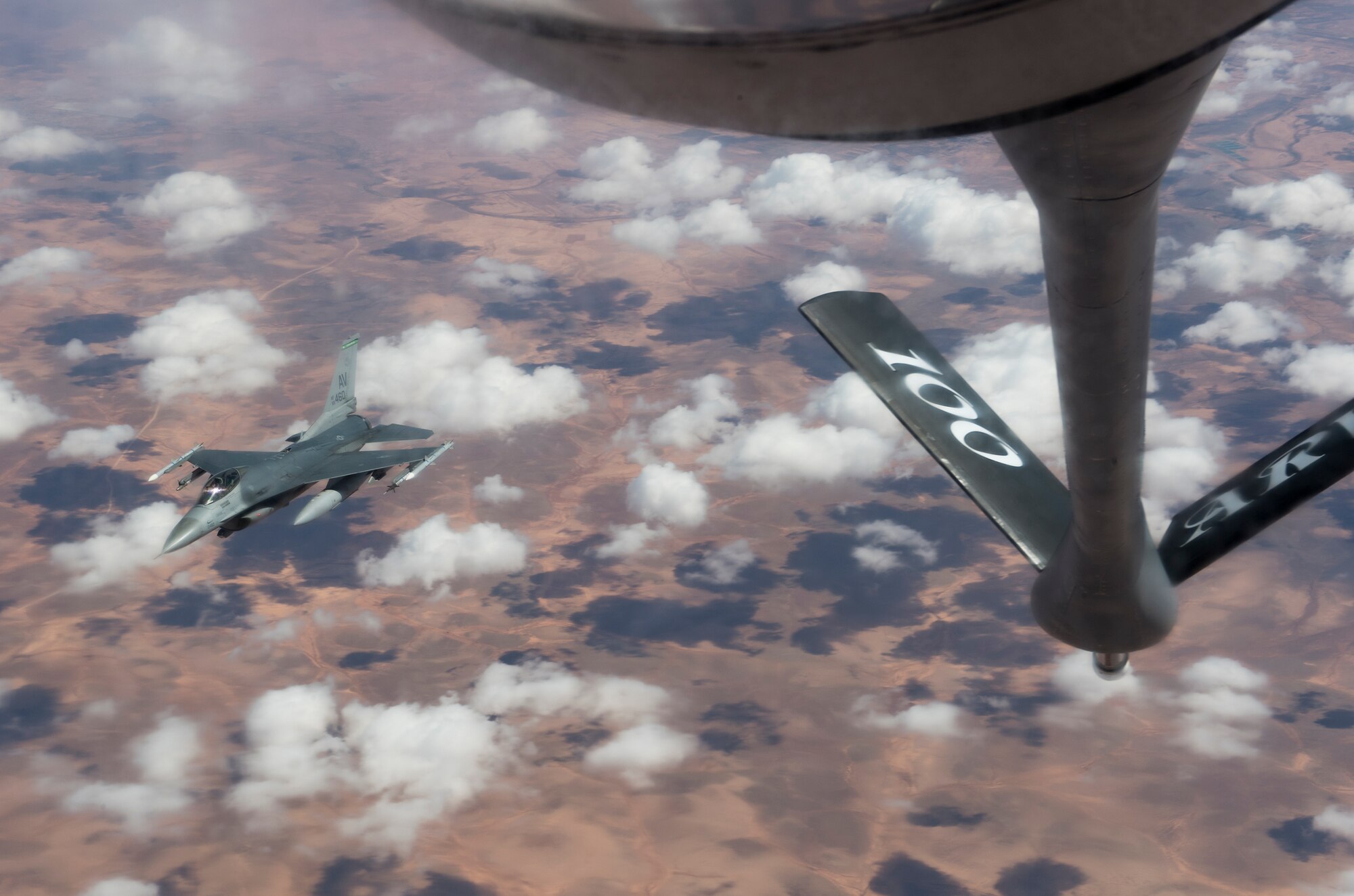 A U.S. Air Force F-16C Fighting Falcon from the 555th Expeditionary Fighter Squadron receives fuel from a KC-135 Stratotanker from the 100th Air Refueling Wing, RAF Mildenhall, England, during exercise African Lion 2019 over the skies of Morocco, April 1, 2019. U.S. Air Force and Royal Moroccan Air Force F-16s conducted aviation training during the multilateral exercise, which was designed to improve interoperability and mutual understanding of each nations’ tactics. (U.S. Air Force photo by Staff Sgt. Ceaira Tinsley)