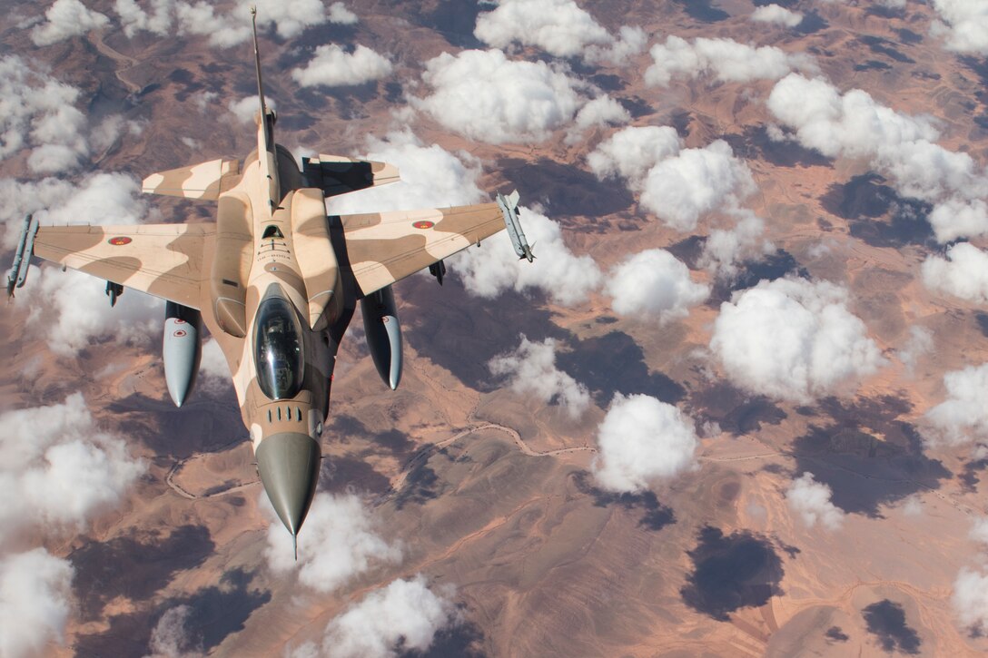 A Royal Moroccan Air Force F-16 prepares to rejoin the formation after receiving fuel from a U.S. Air Force KC-135 Stratotanker from the 100th Air Refueling Wing, RAF Mildenhall, England, during exercise African Lion 2019 over the skies of Morocco, April 1, 2019. The exercise is a continuation of the U.S. and Morocco’s 240-year friendship that dates back to 1777 when Morocco allowed American ships to access its ports. African Lion 2019 is an annual, combined multilateral exercises designed to improve interoperability and mutual understanding of each nation’s tactics, techniques and procedures while demonstrating a strong partnership between nation’s militaries. (U.S. Air Force photo by Staff Sgt. Ceaira Tinsley)