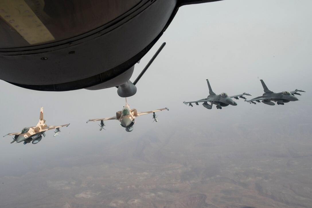 Two Royal Moroccan Air Force F-16s and two F-16C Fighting Falcons from the 555th Expeditionary Fighter Squadron fly over the skies of Morocco after receiving fuel from a U.S. Air Force KC-135 Stratotanker from the 100th Air Refueling Wing, RAF Mildenhall, England, during exercise African Lion 2019, April 2, 2019. The training was an example of U.S. Africa Command and U.S. Marine Corps Forces Europe and Africa’s commitment to maintaining strong military relationships with our allies and partners. African Lion 2019 is an annual, combined multilateral exercises designed to improve interoperability and mutual understanding of each nation’s tactics, techniques and procedures while demonstrating a strong partnership between nation’s militaries. (U.S. Air Force photo by Staff Sgt. Ceaira Tinsley)