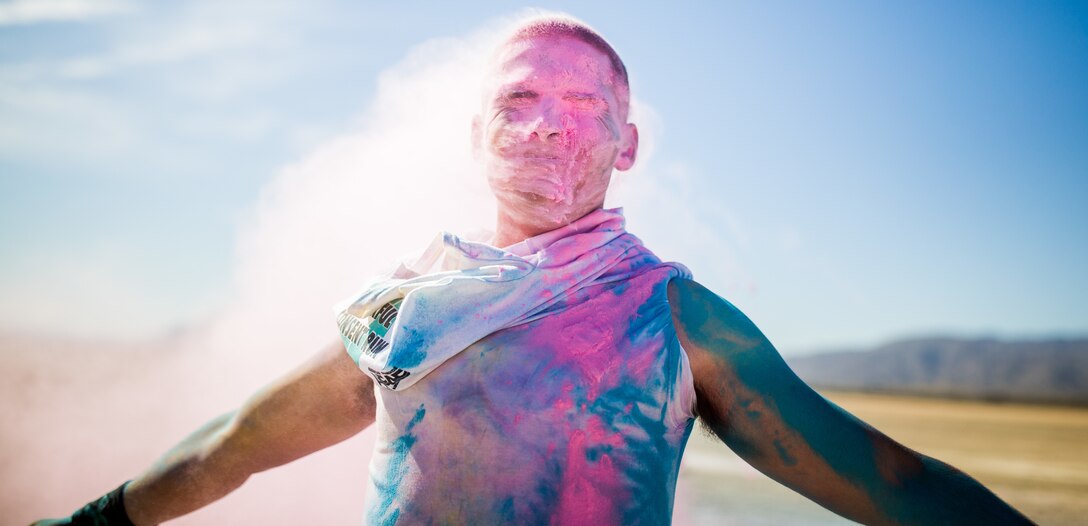 A Participant takes part in the fifth annual Colorful Consent Run on Marine Corps Air Ground Combat Center, Twentynine Palms, Calif,. April 5th, 2019. The 3.2 mile (5 kilometer) run took place in April, Sexual Assault Awareness Month. (U.S. Marine Corps photograph by Pfc. Cedar Barnes)