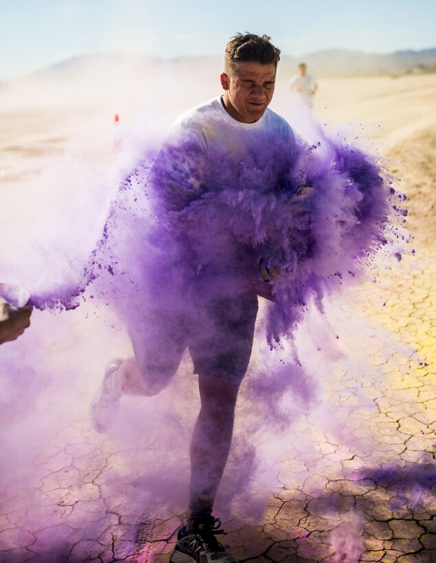 A Participant takes part in the fifth annual Colorful Consent Run on Marine Corps Air Ground Combat Center, Twentynine Palms, Calif,. April 5th, 2019. The 3.2 mile (5 kilometer) run took place in  April, Sexual Assault Awareness Month. (U.S. Marine Corps photograph by Pfc. Cedar Barnes)