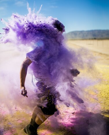 A Participant takes part in the fifth annual Colorful Consent Run on Marine Corps Air Ground Combat Center, Twentynine Palms, Calif,. April 5th, 2019. The 3.2 mile (5 kilometer) run took place in April, Sexual Assault Awareness Month. (U.S. Marine Corps photograph by Pfc. Cedar Barnes)